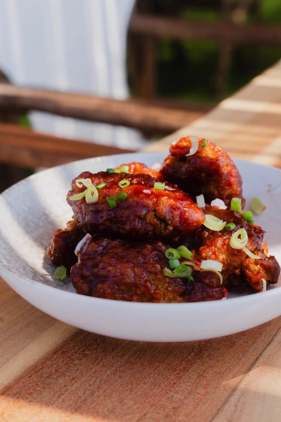 Sticky glazed wings topped with spring onion