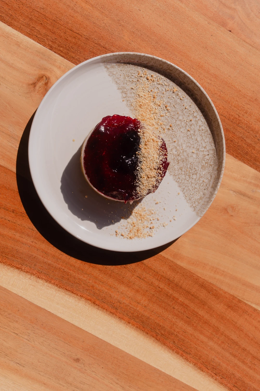 Berry dessert dusted with biscuit crumble